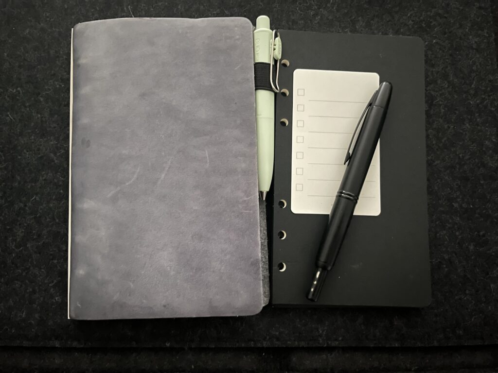 Small binder and notebook with pens